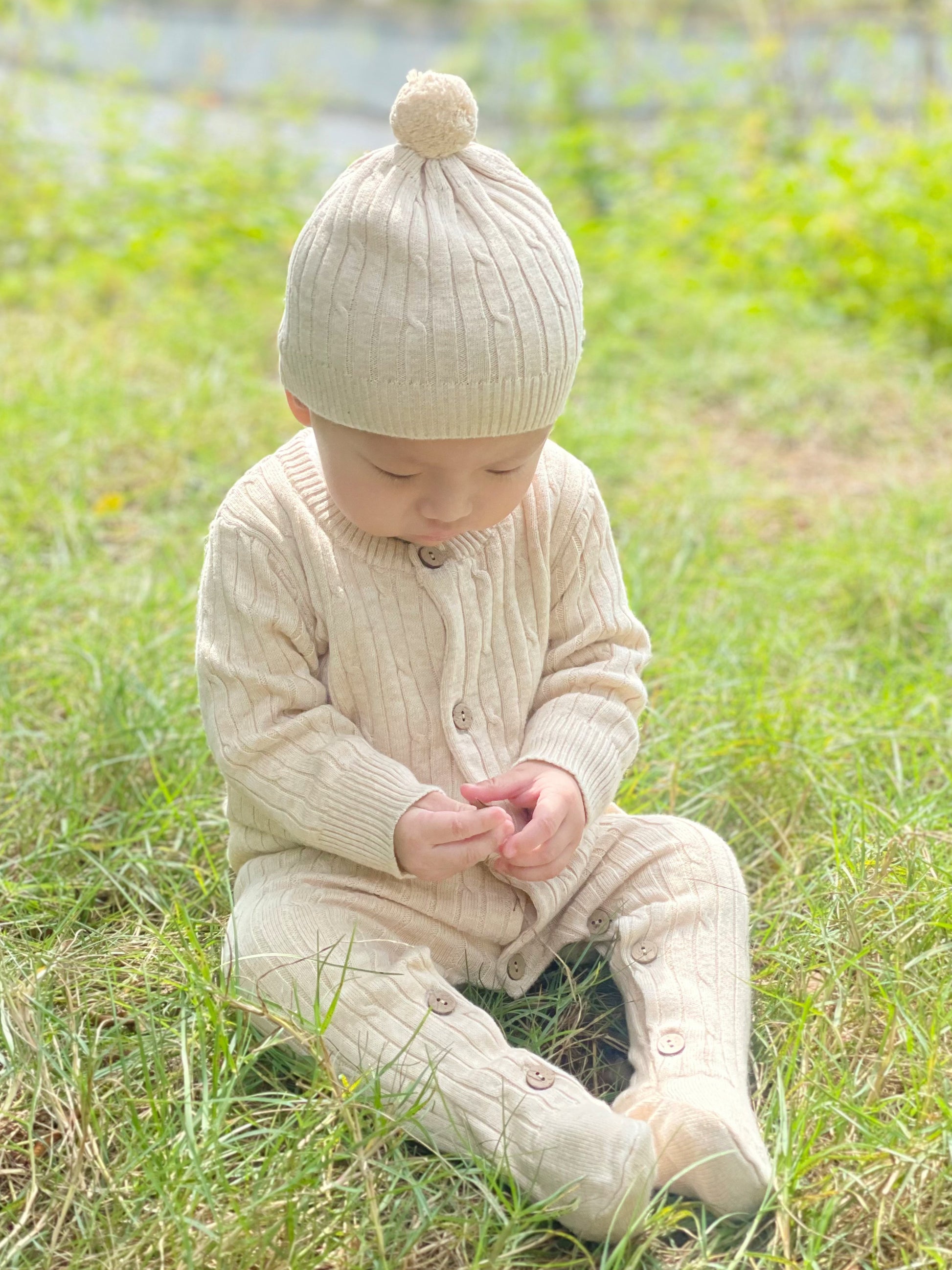 organic knitted footie romper and pom pom hat set