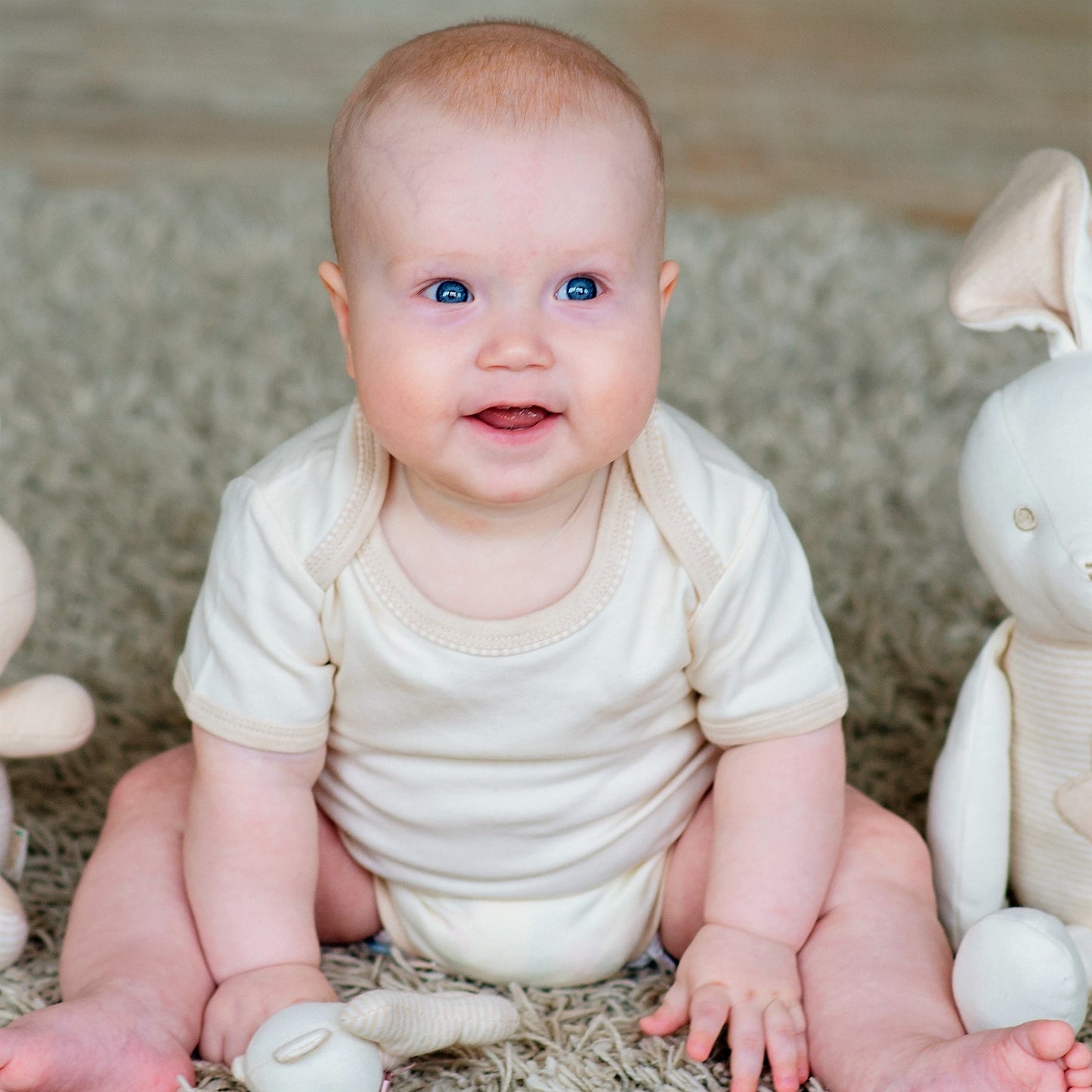 Organic Baby Short Sleeve Onesies: Soft & Sustainable 3-Pack nature white on baby model | Eotton Canada