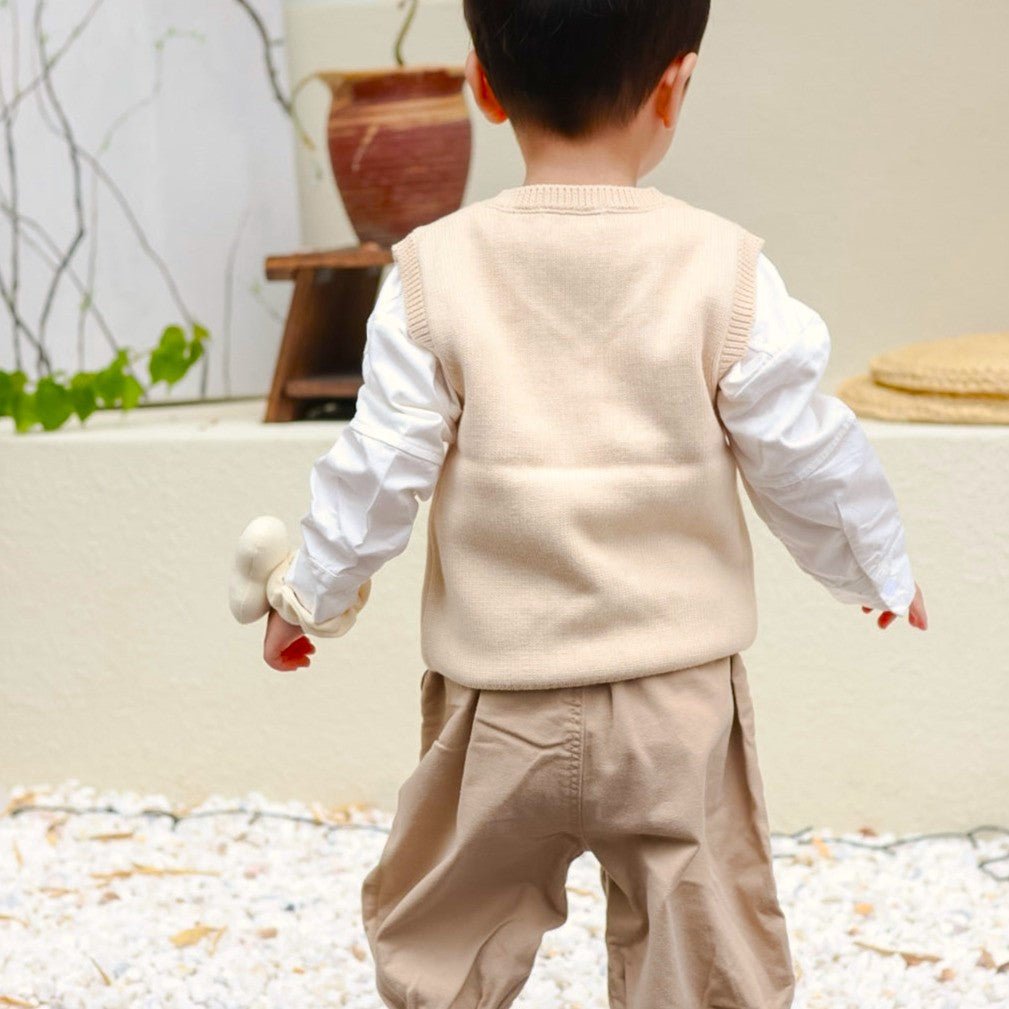 Backside looking for Toddler Knitted Vest: Organic V Neck Sweater Cable Knit | Eotton