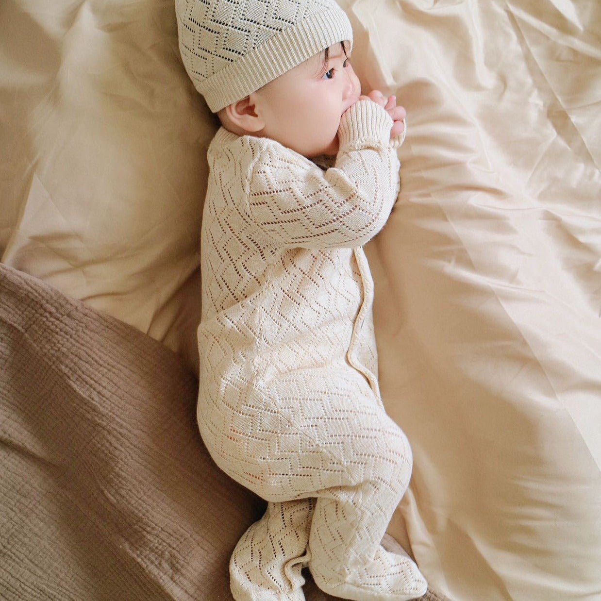 Cable Knit Organic Baby Footed Romper & Hat Set on cute baby | Eotton Canada