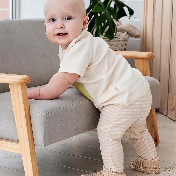 Detailed texture view of the breathable lightweight summer baby trousers knit in thin single jersey stitch.
