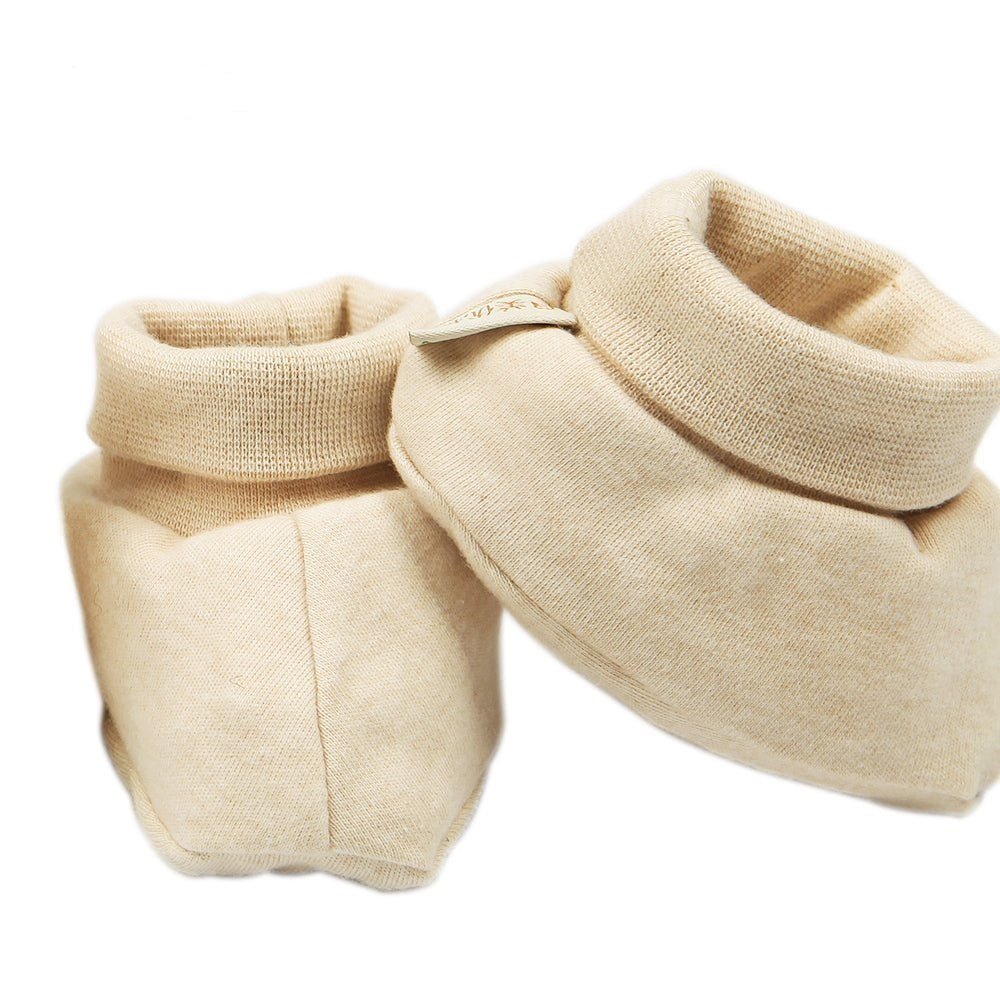 Close up of 185gsm combed organic cotton texture on a newborn bootie | Eotton Canada