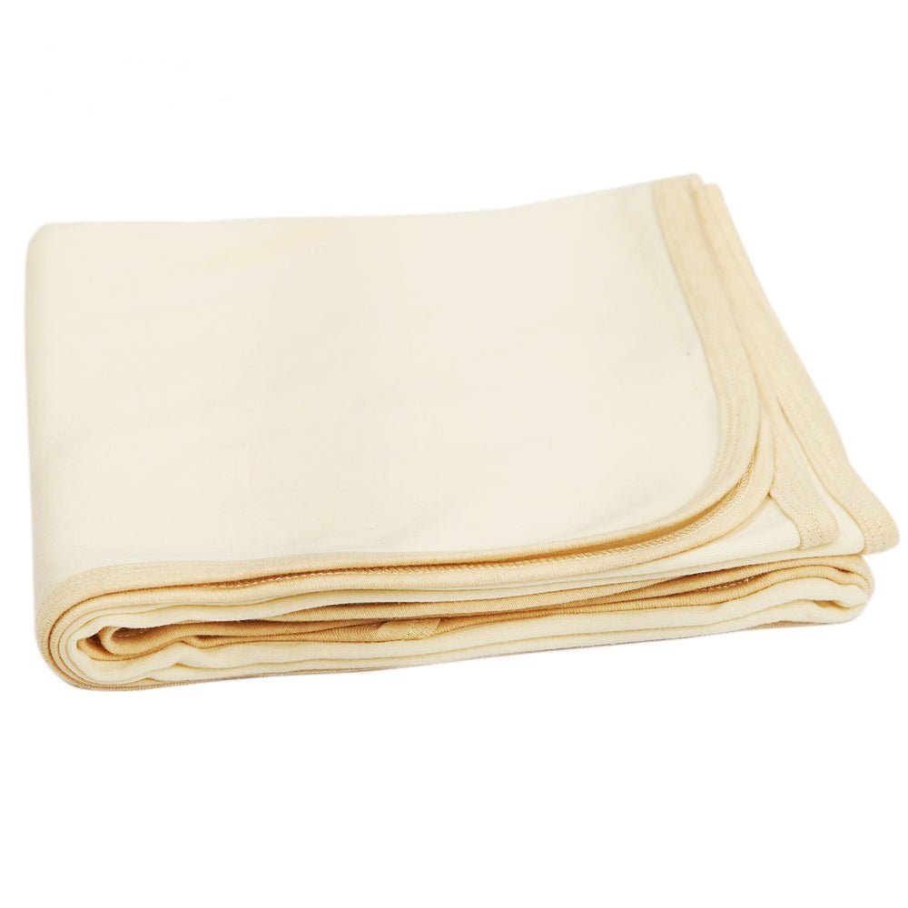 A curated hospital bag essentials layout highlighting our natural white hospital bag organic receiving blanket.