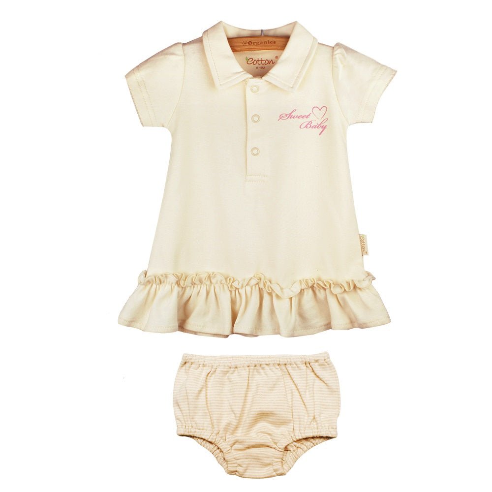 Solid ivory organic baby girl polo dress set showing the short sleeve ruffle dress and matching diaper cover bloomers