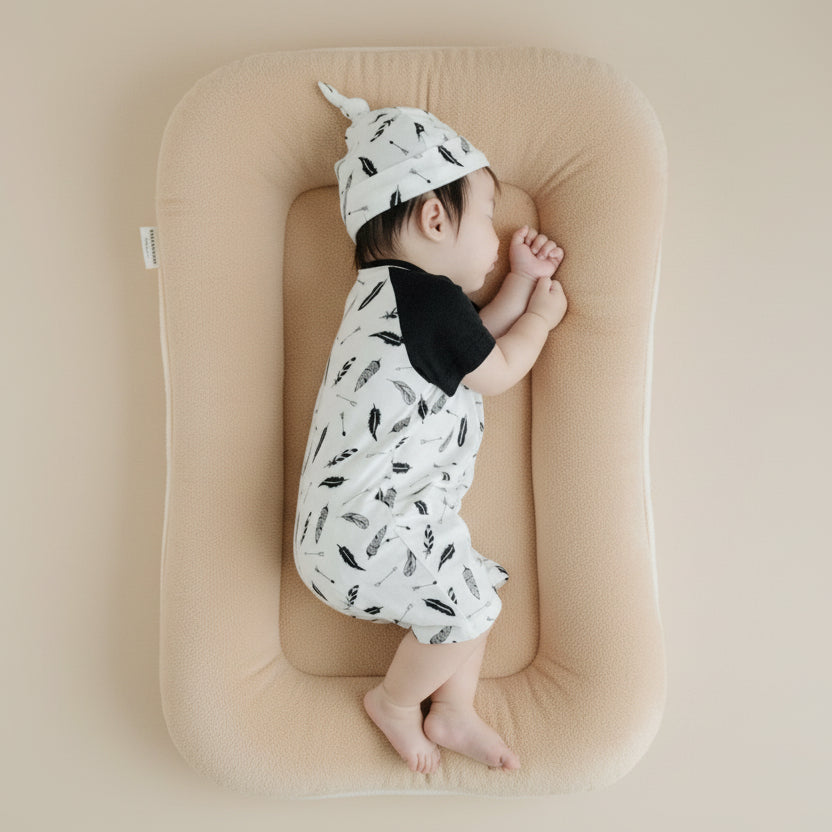 baby sleeping in sweet dream with soft organic cotton romper and hat made with Gots certified organic cotton | best organic baby clothes Canada Eotton