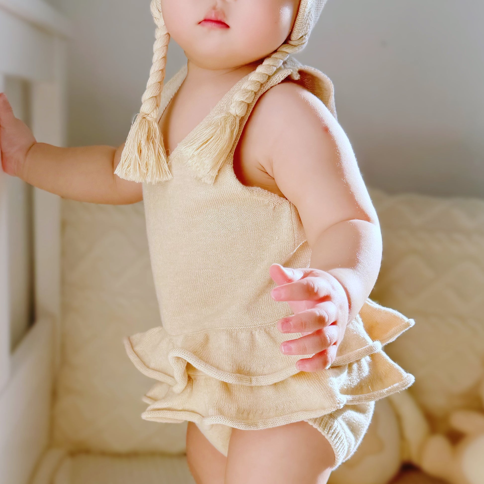 beautiful organic knitted baby girl onesie for photography and daily city walk