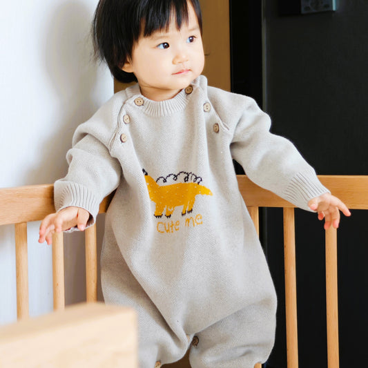 a grey oversized chunky knit organic cotton sweater romper featuring a dinosaur jacquard pattern | Eotton Canada