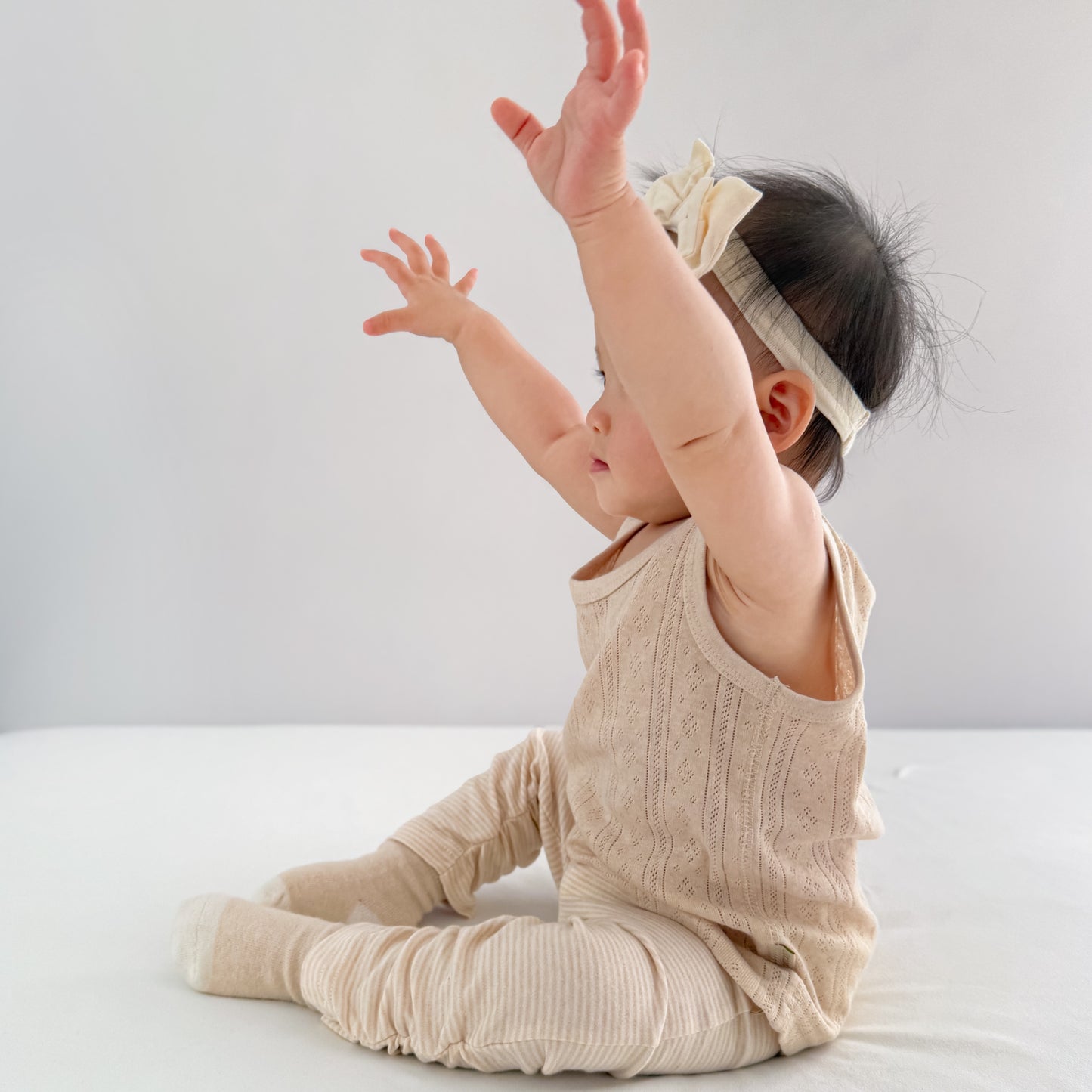Detailed view of the gentle ankle cuffs on our organic cotton footless baby girl leggings.