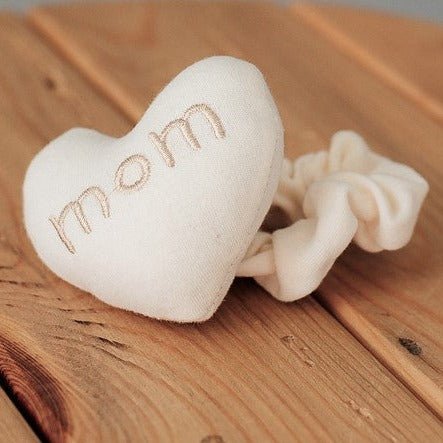 organic cotton wrist rattle toy with mom heart embroidery