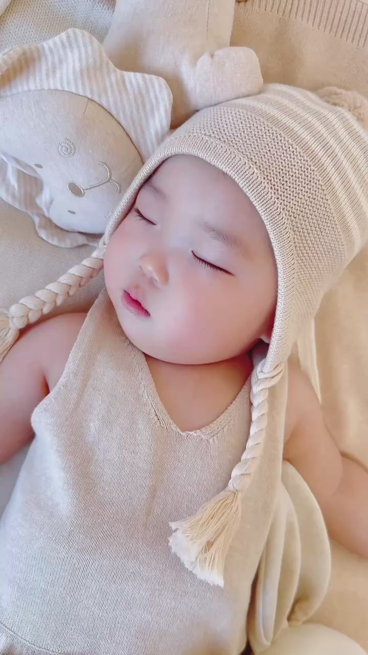 Load video: lovely baby boy dressed Organic Knitted Sweater: Baby Girl Cable Knit Ruffler Onesie | Eotton