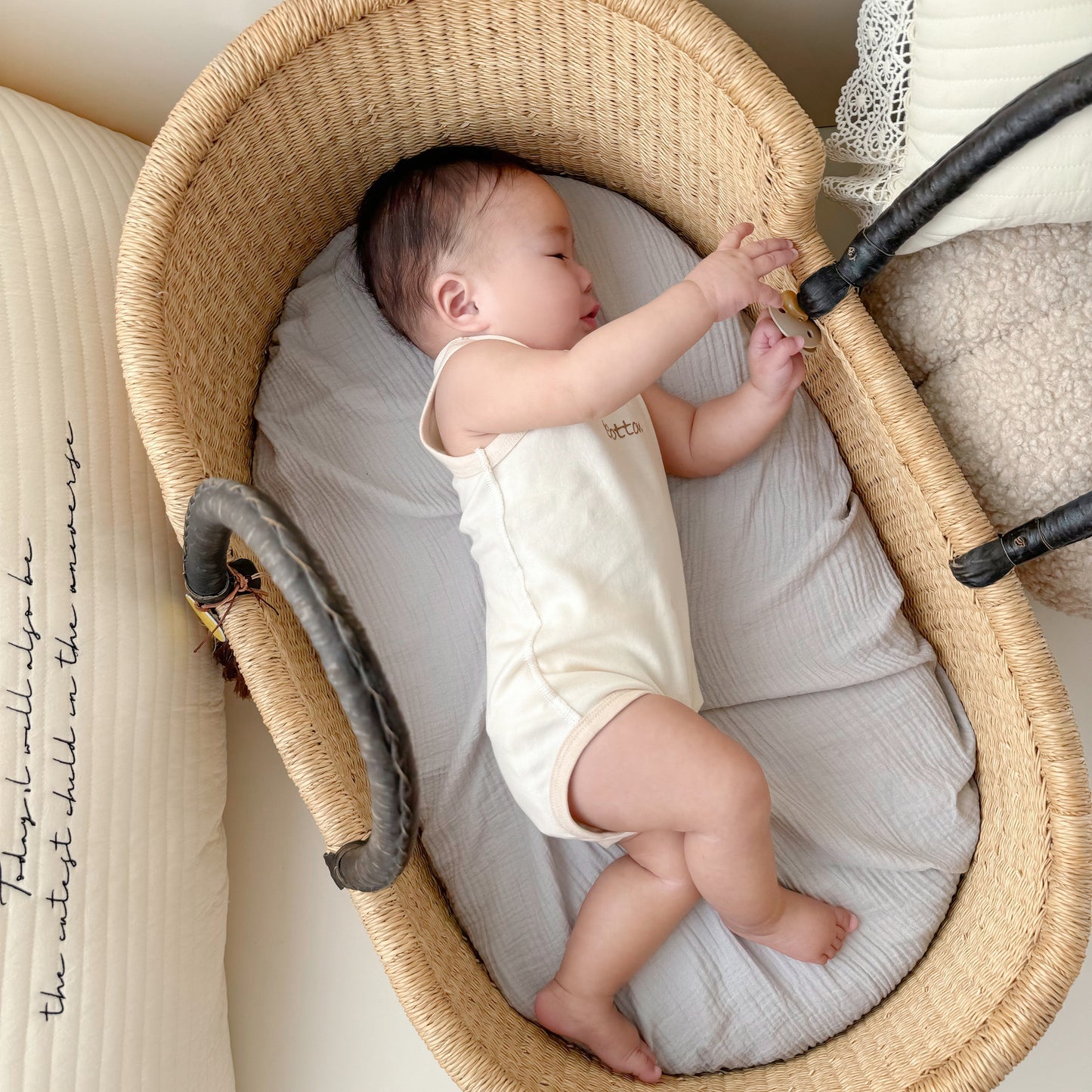 Softest baby short bodysuit in cream, made of certified organic cotton for summer