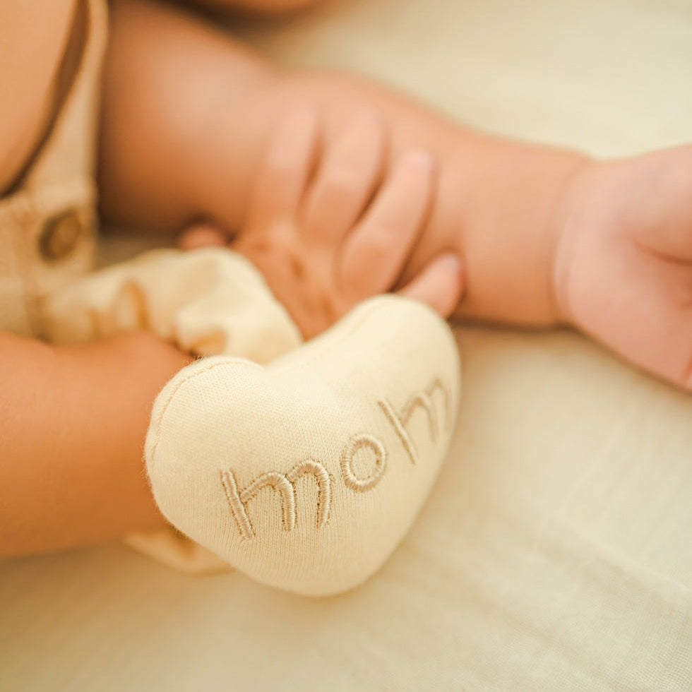 soft organic fabric rattle with gentle chime for newborns