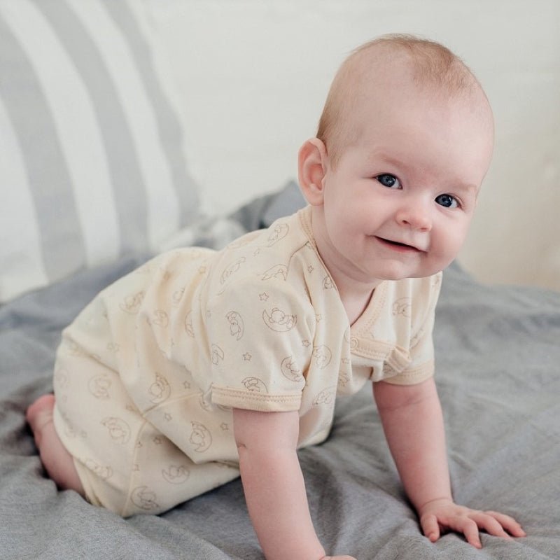 Close up of asymmetrical neckline on organic newborn gown for easy dressing | Eotton Canada