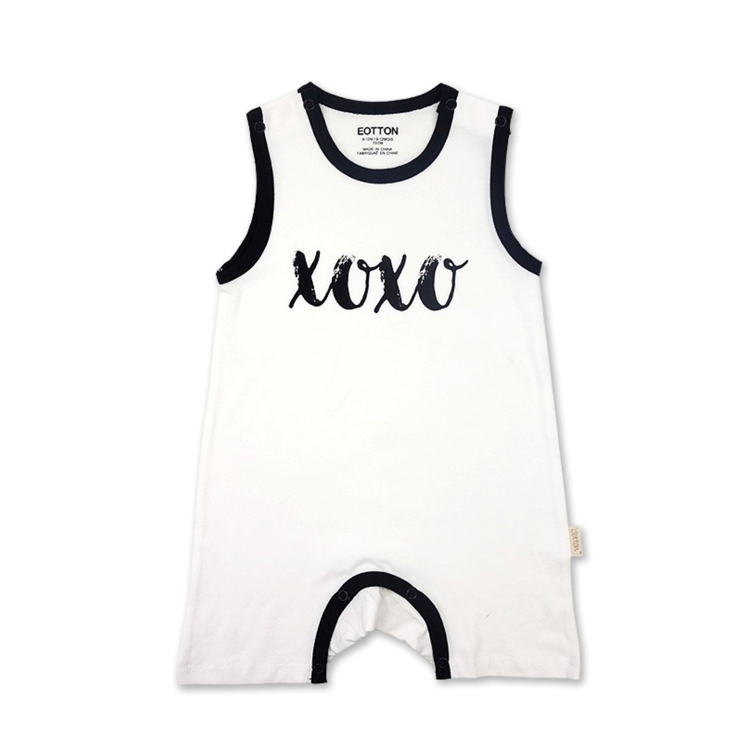 Detailed view of the premium two snap shoulder enclosure on a white organic cotton sleeveless newborn jumpsuit | Eotton Canada