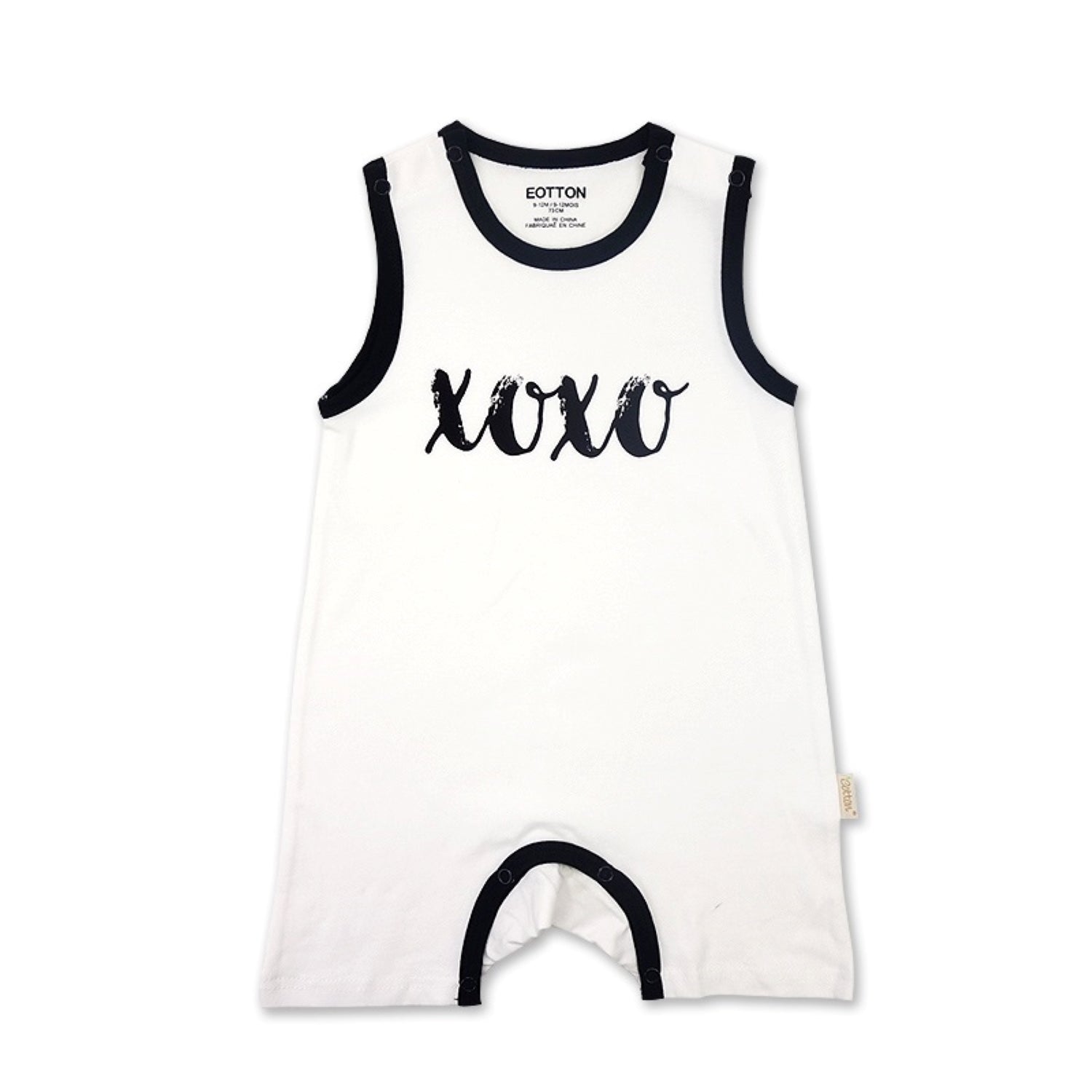 Detailed view of the premium two snap shoulder enclosure on a white organic cotton sleeveless newborn jumpsuit | Eotton Canada
