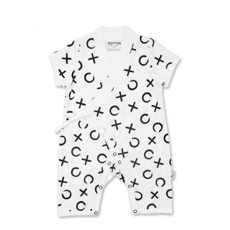 White monochrome newborn wrap bodysuit showcasing a clean high contrast black XO graphic layout with flat side closures.