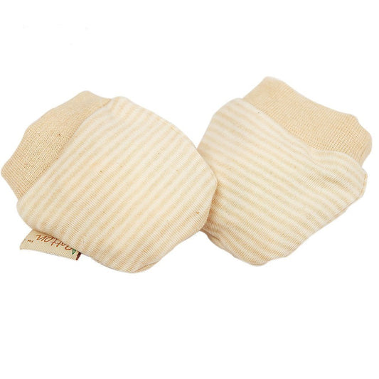 A pair of organic baby mittens in unbleached natural cotton showing the gentle stay on wrist cuffs.