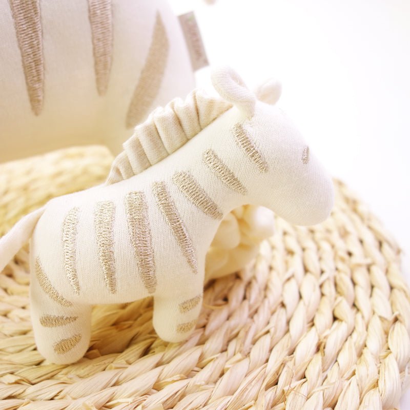 Handmade organic baby rattle zebra with elegant golden embroidery on nature-white cotton | Eotton Canada