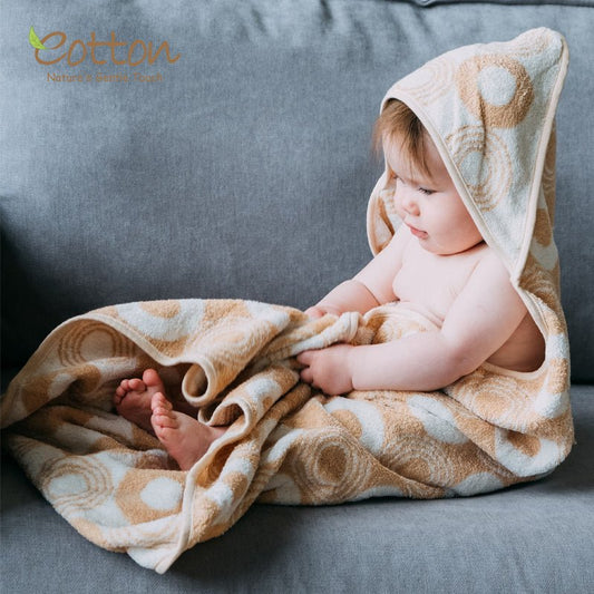 Ultra-absorbent organic cotton hooded baby bath blanket in nature-colored cream circles design | Eotton Canada