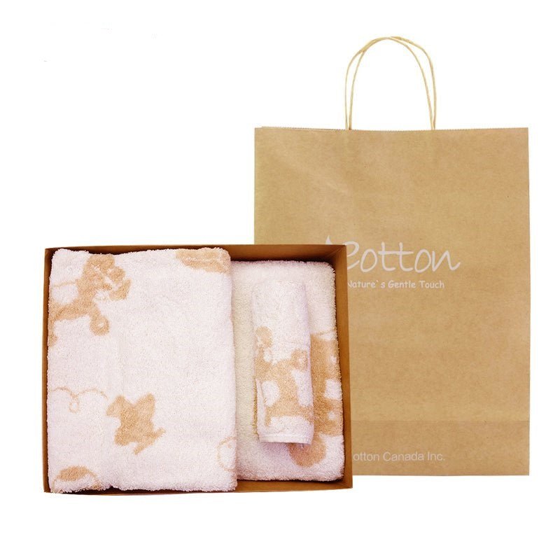 Soft organic infant face towel showing the detailed chemical free butterfly design woven into undyed cotton fibers.