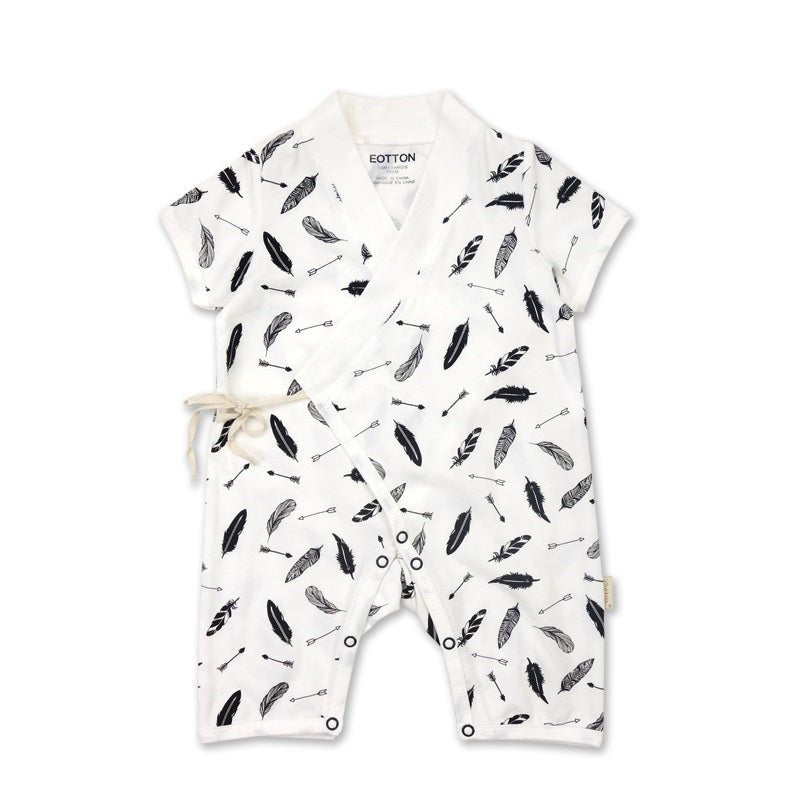 Organic Japanese kimono romper in black cotton displaying a high contrast white feather pattern with short sleeves.