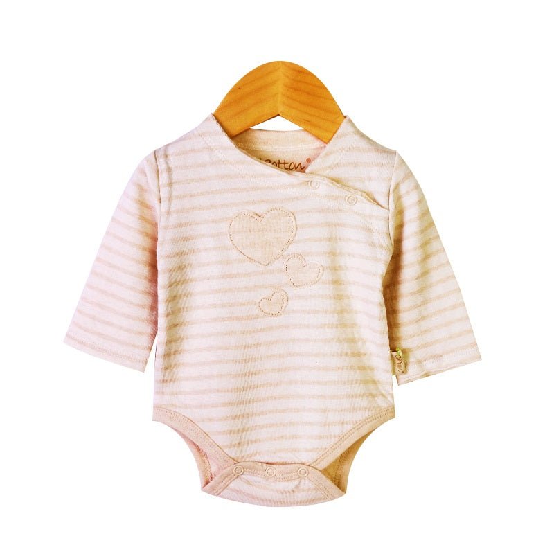 Close-up of raw-cutting brim and asymmetrical neck snaps on organic bodysuit | Eotton Canada