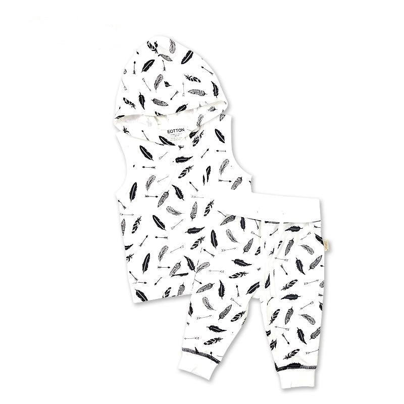 Two piece organic baby sleeveless hoodie and jogger pants set featuring a monochrome feather and arrow pattern print