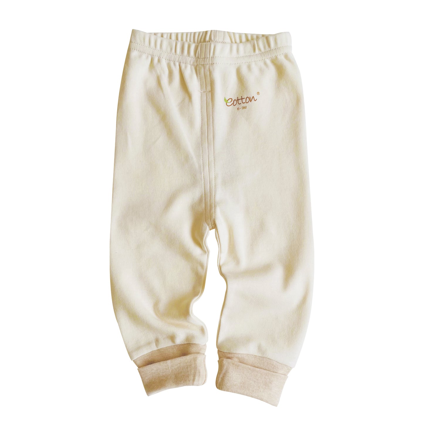 Ribbed baby trousers stacked neatly to display our three premium earth tone organic color paths.