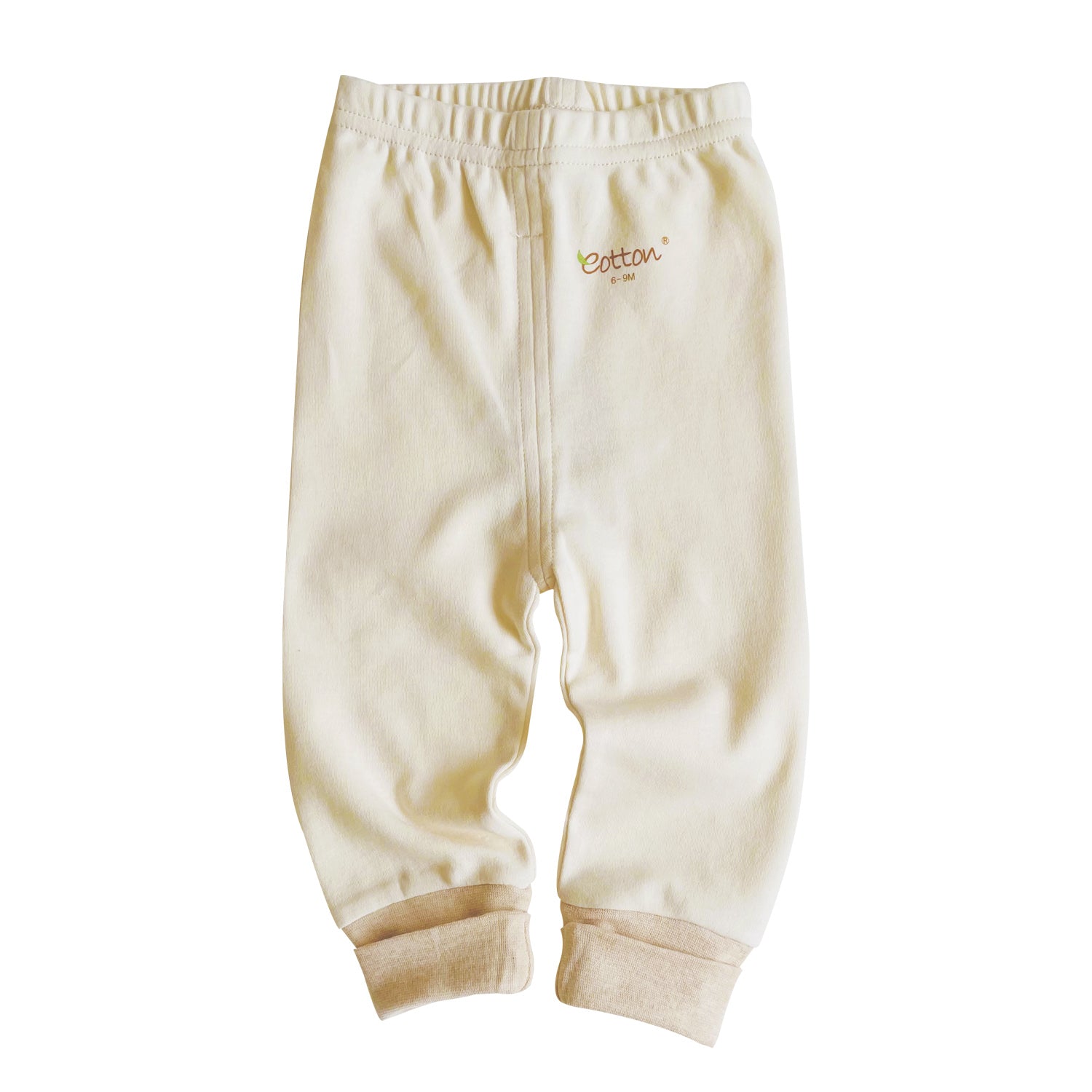 Ribbed baby trousers stacked neatly to display our three premium earth tone organic color paths.