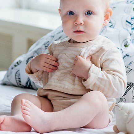 The softest organic baby drool bib in undyed natural cotton bandana style | Eotton Canada